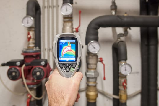 Plumber using a thermal imaging camera to inspect pipes in Union City
