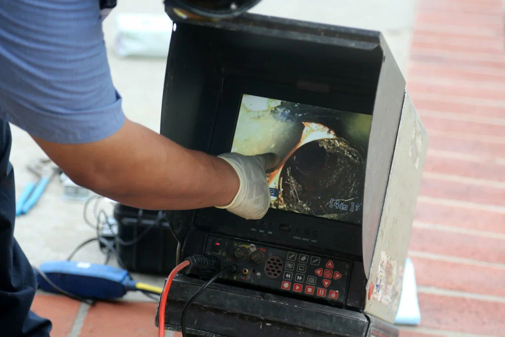 Technician viewing a drain inspection camera in Union City